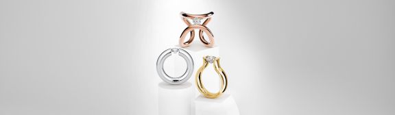 header-niessing-spannring-gruppe-schmuck-ring-juwelierlauferminden